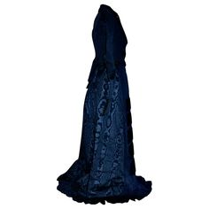 In a Blue Silk Moire, a rare House of Worth circa 1875 Gown. Jacket Bodice: waist 20", length 21 (front), length 26" (back). Skirt: waist 25", length 42.5" (front), length 45" (back). Note: The gown is being offered without the train (bustle) that would have attached to the skirt. Includes a Bonnet (hat), French in matching blue silk c.1875. Possibly by Madame Virot. Gown and hat purchased together. Labeled Petersham 'C. Worth Paris', woven in white on white. on interior of bodice waist. Court Gown, Gown Jacket, Hat French, House Of Worth, Reception Gown, Back Skirt, Bonnet Hat, Blue Silk, Timeless Fashion