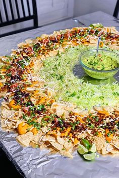 a platter filled with nachos and guacamole