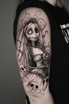 a woman with a skull tattoo on her arm