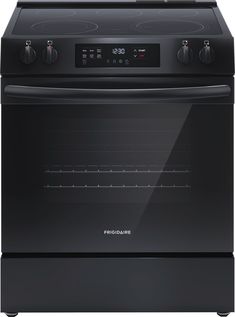 an electric stove with the door open and electronic controls on it's side, in front of a white background