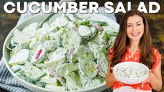 a woman holding a bowl full of salad next to a plate with cucumbers in it