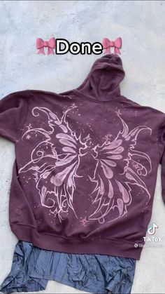 a purple hoodie with white flowers on it and the words donee above it