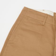 This 1945 military chino from Japan’s Buzz Rickson’s is cut from a neatly woven 100% cotton, and is cut in a vintage loose/straight shape. With a high rise and plenty of length to play around with, this trouser is as comfortable as you would expect it to be. The generous leg opening allows for great freedom of movement, and breathability, while traditional trouser details add an element of formality. Classic side entry pockets are present on the front, while a hidden watch pocket, and welted bac Buzz Rickson, Trousers Details, Watch Pocket, Cotton Chinos, Freedom Of Movement, Care Label, Clothing Co, Us Army, Inside Pocket