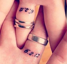 two people with matching rings on their fingers