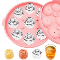 an ice tray filled with lots of different types of candies and some drinks next to it