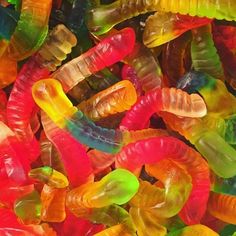 the gummy bears are all different colors and sizes, but they look like worms