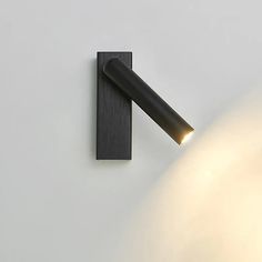 a wall light that is on the side of a wall