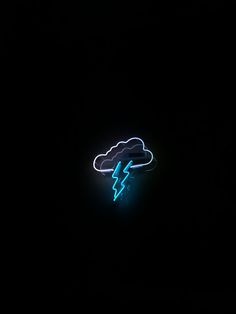 a neon sign that is on the side of a building in the dark with a lightning coming out of it