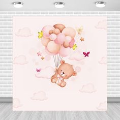 a teddy bear flying in the sky with balloons and butterflies on it's back