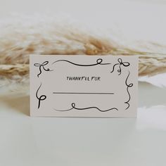 a card that says, thank you for sitting next to some dried plants and feathers