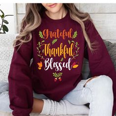 🍂Celebrate Thanksgiving in style with our "Grateful Thankful Blessed" Tee. This cozy and stylish tee is the perfect way to express your gratitude this holiday season. 🍂Whether you're hosting a feast or enjoying a quiet day with loved ones. The classic design features elegant script in fall-inspired colors, Show off your thankful heart and spread the spirit of the season with this must-have Thanksgiving tee.   🍂 Whether you're gathering with family or friends, this tee serves as a reminder of Blessed Thanksgiving, Thanksgiving Sweatshirt, Thanksgiving Tee, Thankful Heart, Thankful And Blessed, Grateful Thankful Blessed, Thanksgiving Dinner, Oversized Sweatshirt, Autumn Inspiration