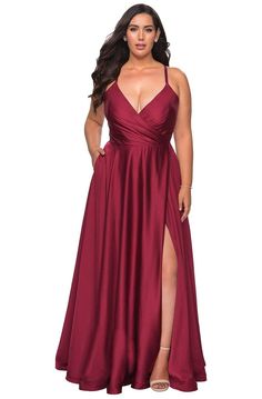 Look fantastic for your next formal event in this evening gown by La Femme 29033. This long satin gown is designed in a sleeveless, plunging V-neckline with a faux wrap bodice and thin straps. The dress has a lace up back while the A-line skirt is tailored with pockets, a side leg slit, and a sweep train finish. Exhibit your softer side in this delightful evening gown by La Femme. Style: lafemme_29033 Details: Satin, Sleeveless, Plunging neckline, Faux wrapped bodice, Thin straps, A-line skirt, Satin Dress Long, Prom Dress Styles, Sleeveless Gown, Prom Style, Designer Prom Dresses, Prom Designs, Masquerade Party