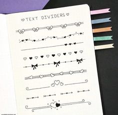 an open notebook with different types of dividers on it next to colored pencils