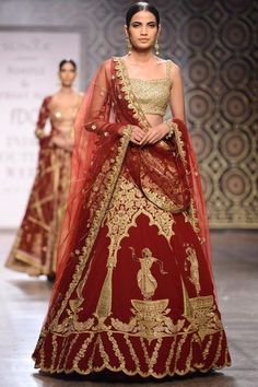 This lehenga is in raw silk with gold zardozi hand work having motiifs around hem. This maroo lehenga skirt has floral dancing figures.  This lehenga choli comes with net dupatta with four sided embroidered border and buties on it. Blouse of this lehenga choli is paired with fully embellished gold colour. Tarun Tahiliani Bridal, Rimple Harpreet, Rimple And Harpreet Narula, Raw Silk Lehenga, Pakistani Couture, Red Lehenga, Lehenga Choli Online, Indian Bridal Wear, Lehenga Collection