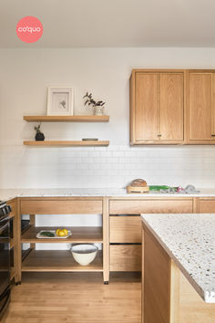 Coquo modular freestanding kitchen cabinets in natural oak with black metal feet. Countertop is quartz a terrazzo imitation. The backsplash is horizontal white subway tile with wood upper cabinets in natural oak with two freestanding wood shelves. Terrazzo Kitchen Countertops, Kitchen Terrazzo, Terrazzo Counter, Terrazzo Kitchen, Modular Kitchen Cabinets, Custom Wood Doors, Modular Kitchen Design, Freestanding Kitchen, Kitchen Designs Layout