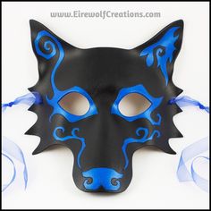 This striking Spiral Wolf masquerade mask features a bold asymmetrical design hand-carved into the leather and painted iridescent blue over black. This handmade mask is suitable for men or women, and is lightweight and designed to fit the average adult face. It ties on with matching bright blue organdy ribbons (black ribbons may be substituted upon request). This mask would wear well with a simple suit, or a more elaborate ensemble -- your masquerade costume can be as low-key or as wild as you w Blue Masks And Prosthetics For Halloween Cosplay, Blue Masks For Halloween Cosplay, Blue Masks And Prosthetics For Cosplay, Blue Mask For Cosplay, Blue Halloween Cosplay Masks, Blue Masks And Prosthetics For Halloween Costume Party, Hand Painted Black Mask For Masquerade, Blue Masquerade Mask For Halloween Costume Party, Blue Masquerade Mask For Halloween