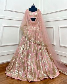 Made to Order/Measurement/Custom Order Lehenga - Color : Blush pink - Fabric : Georgette  - Fully flared paneled lehenga -   Net Dupatta with embroidered  Blouse - Drawstring closure with Tassels - - It can be customize in any design or size  PLEASE NOTE: BUYERS ARE RESPONSIBLE FOR ANY CUSTOMS AND IMPORT TAXES THAT MAY APPLY. This is a made to order product. If you opt for 'Made To Measurement Option', we will provide a measurement template and you can share the measurements likewise. If you want to opt for 'Standard Size', Please refer to the size chart provided in the listing. Shipping: Standard Shipping is done by DHL ecommerce and it mostly takes 2 to 3 weeks to deliver after dispatch. Express Shipping is done by DHL express and it mostly delivers within a week after dispatch. Fabric C Pink Art Silk Choli For Designer Wear, Pink Dola Silk Dress For Reception, Pink Art Silk Choli For Reception, Pink Art Silk Traditional Wear For Reception, Pink Art Silk Gown With Resham Embroidery, Pink Art Silk Gown With Zari Work, Pink Dola Silk Salwar Kameez For Reception, Designer Pink Art Silk Lehenga, Party Wear Wedding Choli With Cutdana