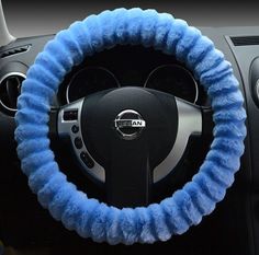 the steering wheel cover is blue and fuzzy