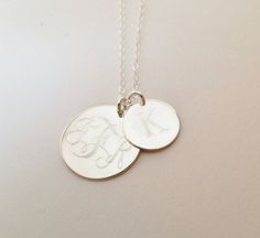 "This sterling silver necklace makes a beautiful present for any mother. I will engrave a monogram or name onto the 3/4\" round pendant, and then a single letter or monogram on the smaller 1/2\" pendant. Pendants and necklace are sterling silver. **Please provide initials in the order you would like them engraved, for Interlocking Monogram it should be First, Last, Middle.** Pendant One - Sterling Silver, 3/4\" diameter Pendant Two - Sterling Silver, 1/2\" diameter Necklace- Sterling Silver, 18\ Interlocking Monogram, Be First, Athens Ga, Single Letter, Mothers Necklace, Monogram Necklace, Round Pendant, Sterling Silver Necklace, Athens