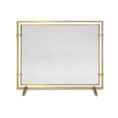 a white and gold framed mirror sitting on top of a wooden stand