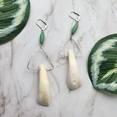 🌿 Nature's Charm: 🌿 Capture the essence of nature's beauty with these unique silver tone earrings featuring real real buffalo teeth (ethically sourced). Each pair is a unique masterpiece, carefully handcrafted to showcase the delicate charm of nature. 🌼 Materials: 🌼 I hand-selected a pair of buffalo teeth. The teeth are attached to a silver tone setting adorned with a turquoise bead, adding a touch of sophistication to these stunning earrings. The triangle has a hand hammered texture. The se Animal Bone Jewelry, Nature Materials, Bone Jewelry, Real Real, Hammered Earrings, Animal Bones, Goth Jewelry, Stunning Earrings, Gifts For Nature Lovers