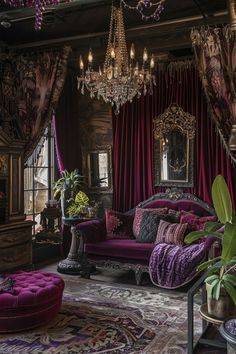 an ornate living room with purple couches and chandelier hanging from the ceiling