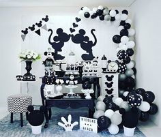 a mickey mouse party with balloons and decorations