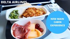 there is a tray with different types of food on it and the words delta airlines new main cabin experience