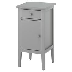 a small gray cabinet with two drawers