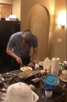 a man is preparing food in the kitchen