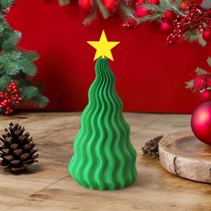 a small green christmas tree with a star on top