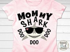 a pink shirt with the words mommy shark do doo on it and a shark wearing sunglasses