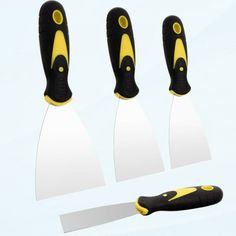 three knives with yellow handles and black blades