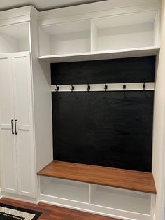 a black and white wall mounted coat closet