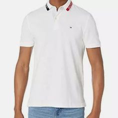 Description Features: A Classic In Every Sense Of The Word. This Tommy Hilfiger Polo Shirt Is A Casual Wardrobe Must-Have. Polo Shirt For Men Available In A Custom Fit. Polo Shirt Collar With A Two-Button Placket. Embroidered Flag At Chest On This Polo Shirt For Men. This Polo Shirt From Tommy Hilfiger Is Perfect For Any Casual Occasions. Product Details: A Classic In Every Sense Of The Word. This Tommy Hilfiger Polo Shirt Is A Casual Wardrobe Must-Have. Polo Shirt For Men Available In White Polo Shirt With Collared Neckline For Spring, Tommy Hilfiger Fitted Casual Shirt, Fitted Casual Tommy Hilfiger Shirt, White Cotton Polo Shirt For Spring, White Collared T-shirt For Summer, Tommy Hilfiger Cotton Polo Shirt Short Sleeve, Tommy Hilfiger Cotton Short Sleeve Shirt, Casual Fitted Tommy Hilfiger Polo Shirt, Fitted Tommy Hilfiger Casual Polo Shirt