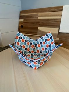 a paper bag sitting on top of a wooden table