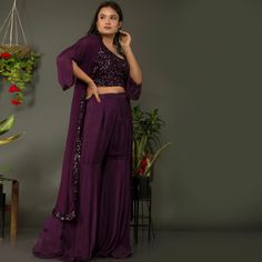 🌟Introducing TARZ's Indowestern Crop Top Sharara Pants with Jacket Set!🌟 💃Elevate your style and make a statement at any event with this exquisite indowestern ensemble from TarzIndianLehenga. Crafted from the finest georgette fabric, this outfit is designed to make you stand out in the crowd and leave a lasting impression.💃 🌠Imagine a starlit night, the sky adorned with twinkling sequins and the gentle rustle of georgette fabric as you glide across the room. This enchanting scene comes to life with our indowestern crop top sharara pants and jacket set, creating a magical experience that's sure to captivate all who witness it.🌠 👗OUTFIT DETAILS👗 ✨FABRIC: Georgette ✨INNER BLOUSE: Round neck with sequins work ✨JACKET: Long jacket with 3/4th sleeves ✨BOTTOM STYLE: Sharara pants ✨BOTTOM Party Wear Semi-stitched Sharara With Sequins, Festive Floor-length Sequined Sharara, Semi-stitched Party Sets For Diwali, Diwali Georgette Sets With Mirror Work, Festive Designer Pant Set With Mirror Work, Anarkali Pant Set With Mirror Work For Festive Occasions, Bollywood Festive Pant Set With Mirror Work, Festive Bollywood Pant Set With Mirror Work, Festive Straight Kurta Pant Set With Mirror Work