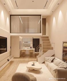 a living room filled with furniture next to a staircase