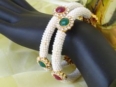 bracelet bangles indian pearl bead white, red green stone artikriti 3 Green Stone Bracelet, Green Stones, Bead Bangles, Pure Beauty, Water Lily, Bangles Jewelry, Indian Jewellery, White Beads, Green Stone