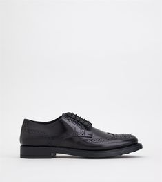 Lace ups in elegant smooth leather with English style wing-tip perforations, stamped monogram and a rubber outsole with embossed rubber pebbles. Tods Shoes Mens, Shoe Tree, Monogrammed Leather, Derby Shoes, Leather And Lace, All Black Sneakers, Smooth Leather, Leather Shoes, Black Men