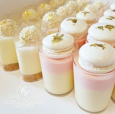 small desserts are lined up on a table with gold confetti around them