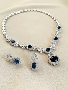 This super sparkly and gorgeous AAA sapphire blue surrounded with clear Cubic Zirconia necklace is simply elegant and stunning.  This necklace will be guaranteed to make you sparkle. Necklace Length: 16.5inches Earring Size: 3cmx1.2cm Orders are sent within 1-3 business days after payment receive. Thank you so much for looking (If you have any question, feel free to inbox me) ASparklingOccasion **POLICIES** Please take a look at the policies before purchase  www.etsy.com/shop/ASparklingOccasion/ Blue Necklace Set, Zirconia Necklace, Sparkle Necklace, Cubic Zirconia Necklace, Sapphire Wedding, Jewelry Bridal, Bridesmaid Necklace, Blue Necklace, Sapphire Jewelry