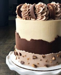 there is a cake with chocolate and cream frosting on it