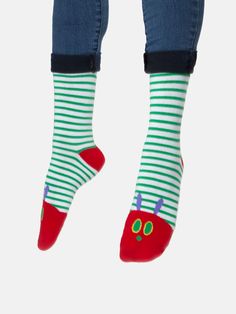 "One Sunday morning the warm sun came up and - pop! - out of the egg came a tiny and very hungry caterpillar." Product Details Unisex 75% cotton, 20% polyester, 5% spandex Size & Fit Small: Shoe Sizes: 5.5-9/Sock: 9-11 Large: Shoe Sizes: 8.5-12/Sock: 10-13 Each purchase helps to fund literacy programs and book donations to communities in need. Cotton Socks For Spring Stocking Stuffers, Cute Green Socks For Spring, Fun Green Cotton Socks, Multicolor Cotton Socks For Playtime, Playful Multicolor Cotton Socks, Playful White Socks, Playful Green Socks For Stocking Stuffers, Playful Red Cotton Socks, Cute Cotton Socks For Playtime