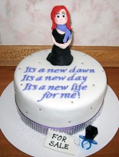 a birthday cake with a woman holding a baby in her arms and the words it's a new dawn, fix a new day its a new life for me