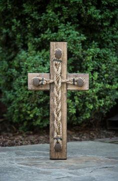 a cross made out of wood and rope