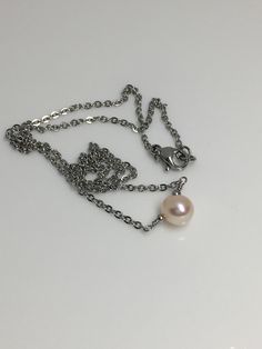 "5mm Peach cream solitaire fresh water pearl hypoallergenic stainless steel sturdy shiny cable chain lobster claw closure necklace. Available in 14\",15\",16\", 18\" Hand made jewelry! All purchase will arrive in gifts boxes Thanks for stopping by! See similar listings https://www.etsy.com/listing/746071892/single-pearl-necklace-solitaire-pearl?ref=shop_home_active_1&frs=1 https://www.etsy.com/listing/746055542/single-pearl-necklace-solitaire-pearl?ref=shop_home_active_3&frs=1" Pearl Necklace With Cable Chain For Gift, Stainless Steel Pearl Chain Necklace For Gift, Gift Jewelry With Pearl Chain In Stainless Steel, Gift Jewelry With Pearl Chain And Stainless Steel, Stainless Steel Jewelry With Pearl Chain For Gifts, Pearl Cable Chain Necklaces As Gift, Nickel-free Pearl Necklace For Gift, One Pearl Necklace, Gifts Boxes