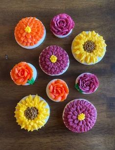 cupcakes decorated with colorful flowers and the words fall bouquet on top of them