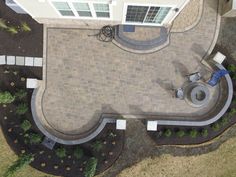 an aerial view of a patio and landscaping area