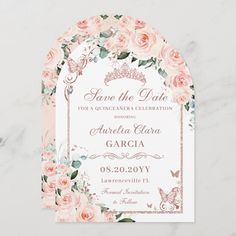 wedding save the date card with pink roses and butterflies on it, in front of a marble